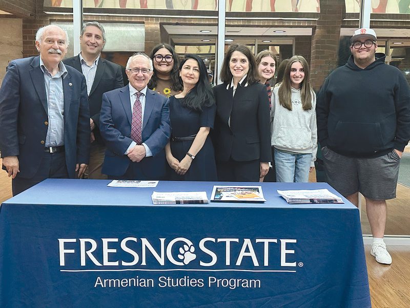 Faculty, community members and students at a Fresno State Armenian Studies Program table