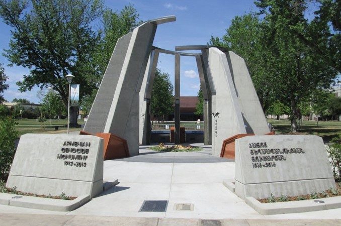 The Armenian Genocide Monument at Fresno State: nine broken concrete columns and inscribed stones in English and Armenian, dated 1915–2015
