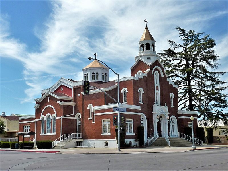 Holy Trinity Armenian Apostolic Church, a red-brick church with white trim and a bell tower, at Ventura and M Streets